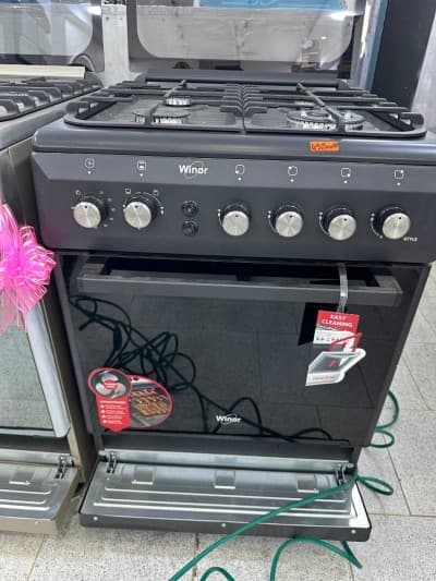 Cuisinière winor 4 feux Four ventilé inox