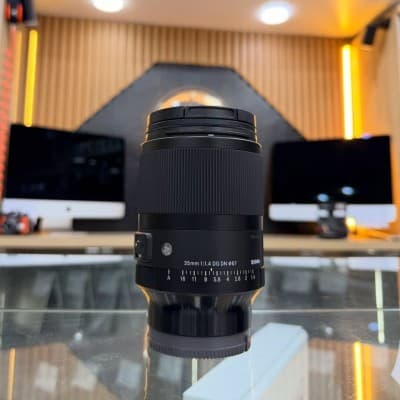 Sigma 35mm 1.4 DG DN Sony E-mount en excellent etat avec deux bouchons